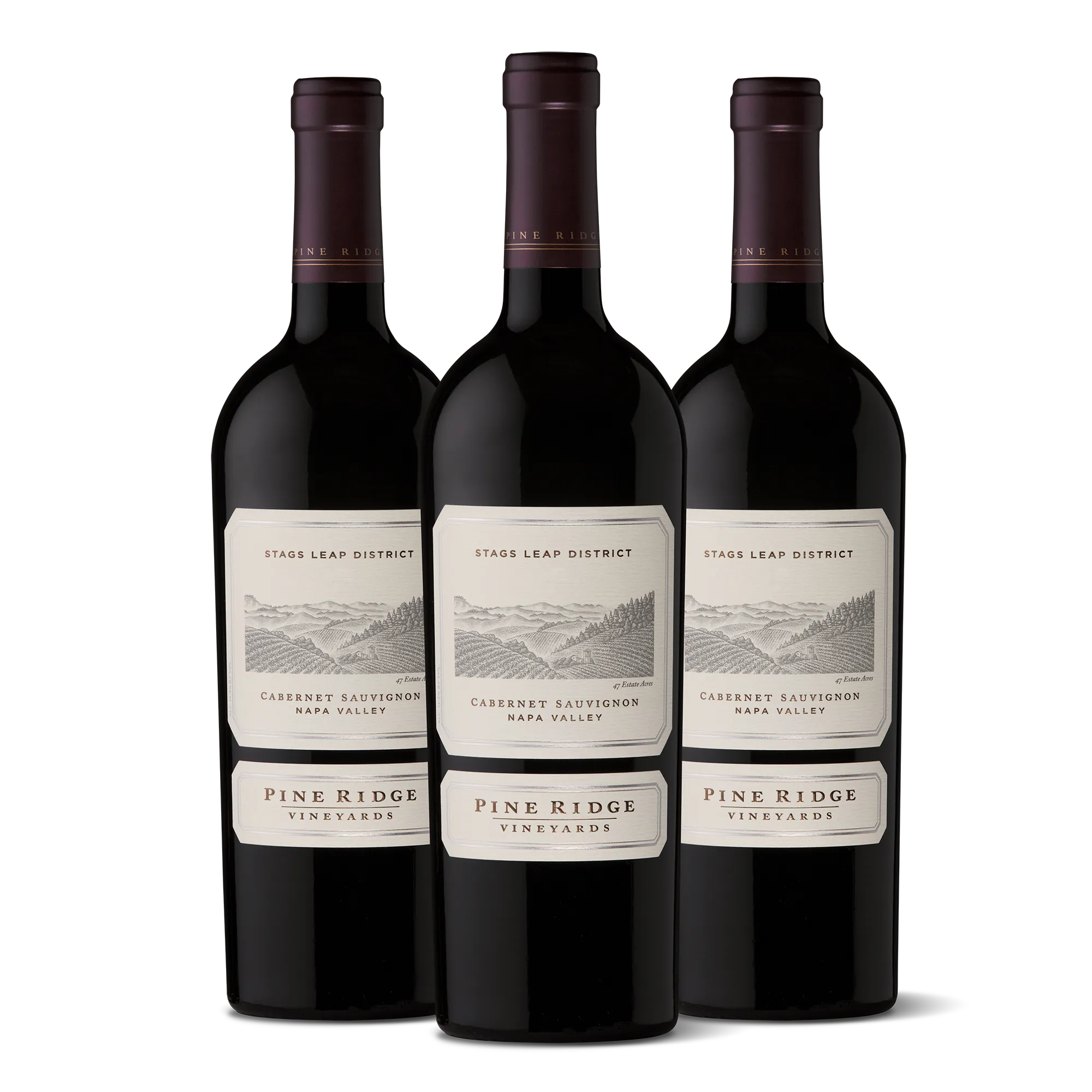 Three bottles of Pine Ridge Vineyards Cabernet Sauvignon from Napa Valley’s renowned Stags Leap District are displayed upright in a row against a plain white background, elegantly representing the 2023 Stags Leap District 3-Bottle Collection.
