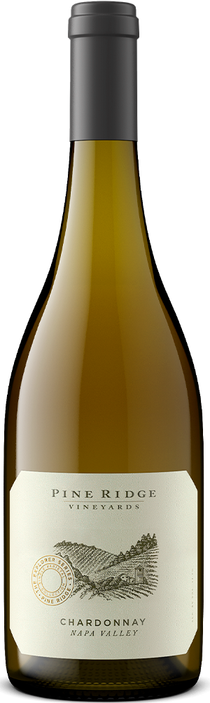 A bottle of Pine Ridge Vineyards Chardonnay from Napa Valley, reminiscent of a fine Sauvignon Blanc. The wine bottle has a yellow tint and features a label with a vineyard illustration and text. The neck of the bottle is elegantly sealed with a silver capsule.