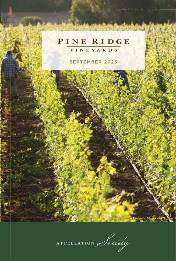 Rows of green grapevines in a vineyard with two people working among the vines. Sunlight filters in from the side. Text reads Pine Ridge Vineyards September 2025 Appellation Society.