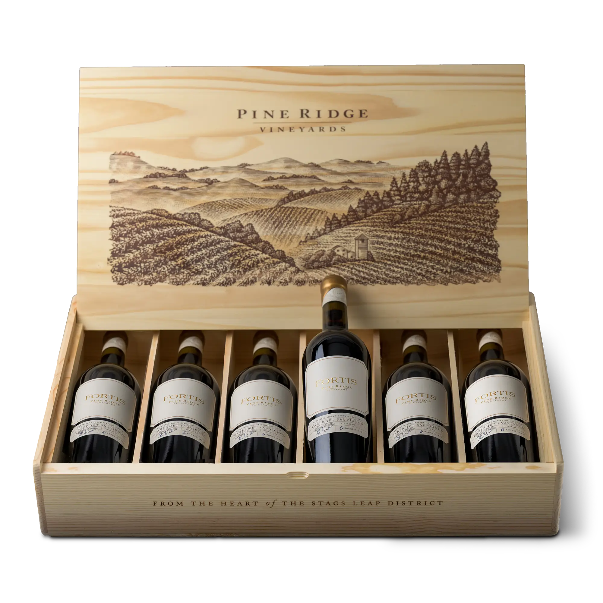 Six bottles of the 2022 FORTIS 6-Bottle Collection are arranged in a wooden Pine Ridge Vineyards box with an engraved landscape scene on the lid. The box’s front reads, From the heart of the Stags Leap District.